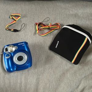 Blue Polaroid camera with case and lanyard handle straps